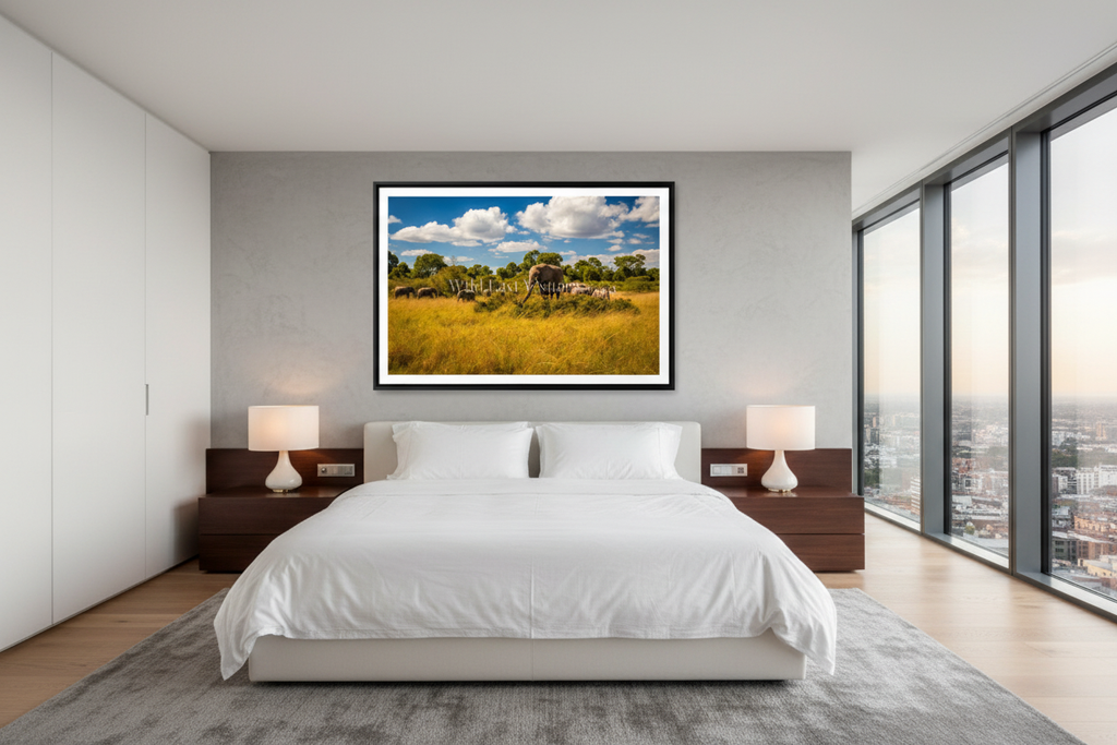 Family Table fine art giclée print displayed above a king bed in a modern luxury bedroom — African elephant wildlife wall art — Wild East Visuals