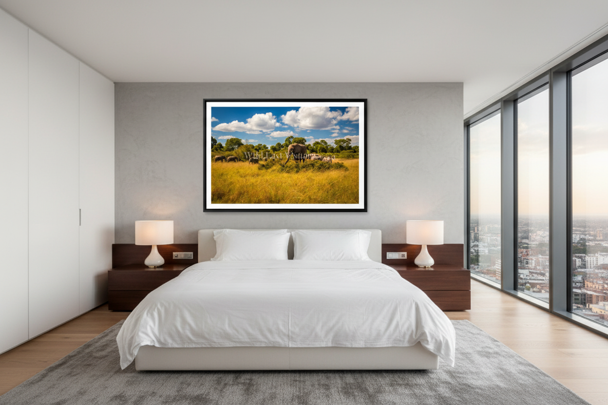 Family Table fine art giclée print displayed above a king bed in a modern luxury bedroom — African elephant wildlife wall art — Wild East Visuals