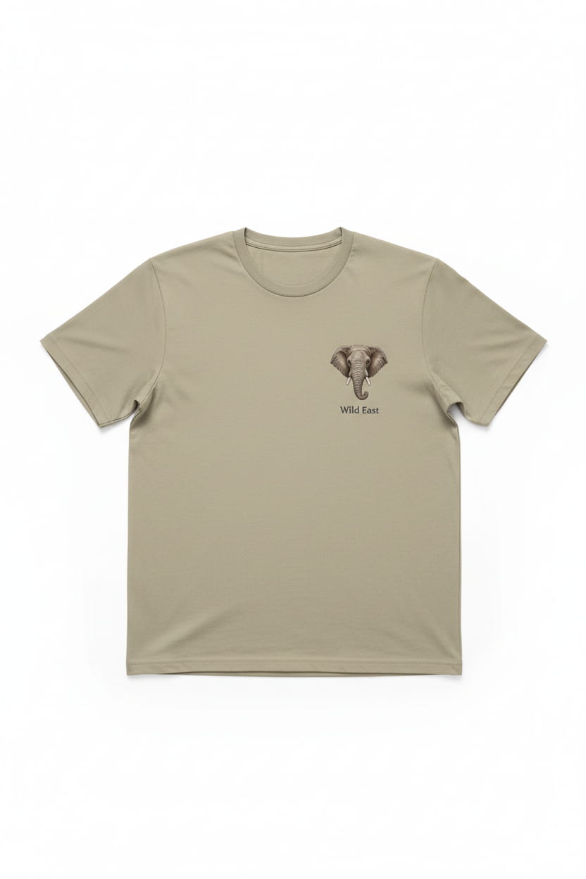 Wild East Sand Tee flat lay — elephant badge on left chest, 100% cotton, handcrafted in Nairobi — Wild East Visuals