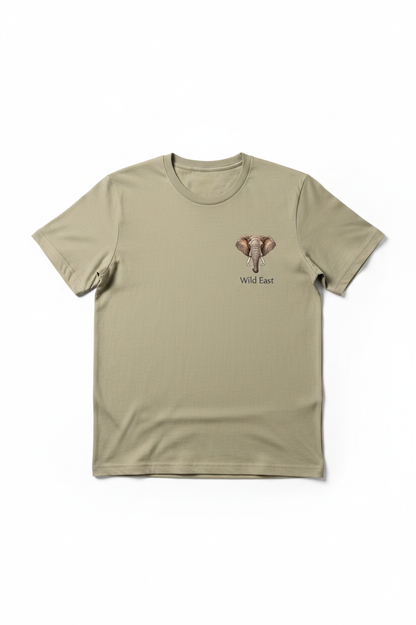 Wild East Sand Tee flat lay — precision elephant badge on the left chest, 100% cotton 180gsm, limited to 100 pieces per size. Handcrafted in Nairobi, Kenya. Wild East Visuals.