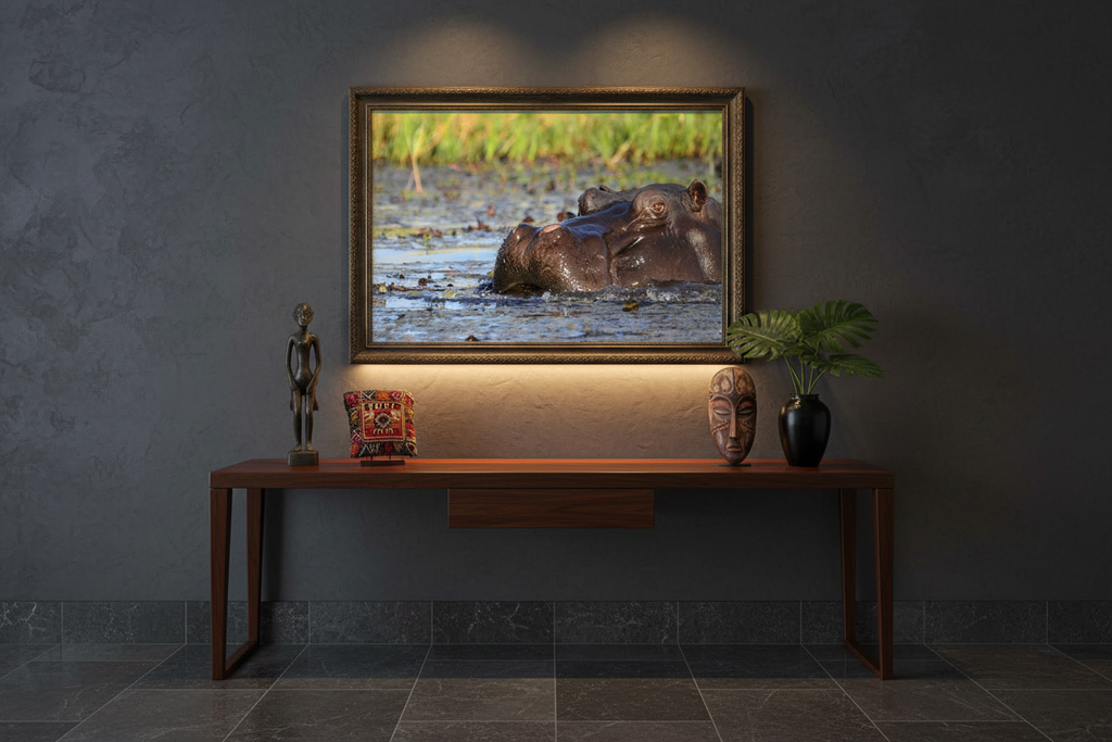 The Sovereign — Hippo Rising, limited edition fine art wildlife print displayed above a dark wood console table in a sophisticated gallery-style hallway — Wild East Visuals